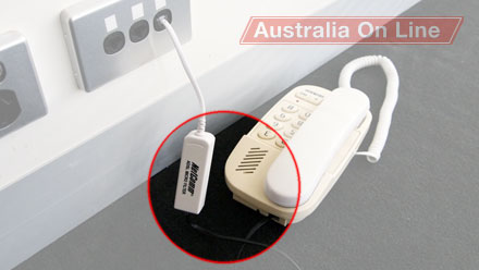 Connect a telephone cable to the ADSL modem's 'Line' socket (the leftmost socket) and the building's phone line socket. 